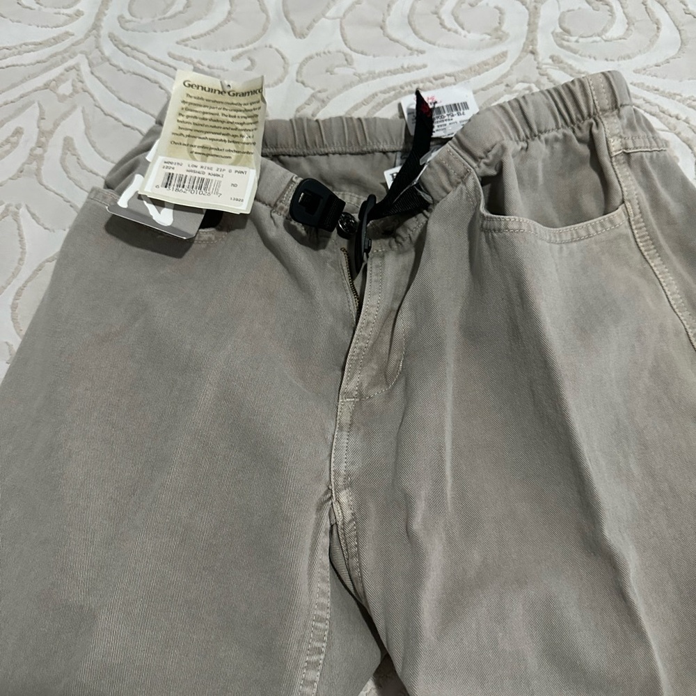 Women’s tan Pants with belt. New with tags.